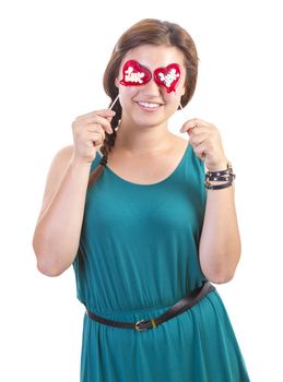 smiling teenager girl with heart shaped lollipop on white background