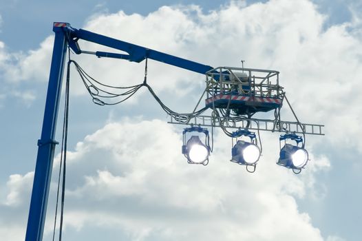 high powered spotlights illuminating an outdoor movie set