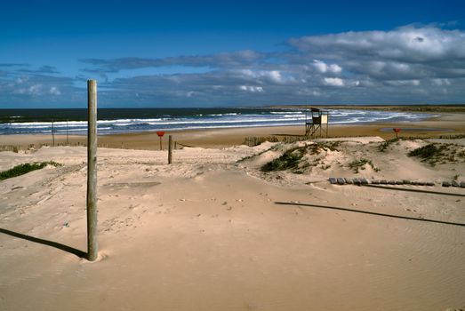 Amazing view of a lifeguard tower standing on a beach in Cabo Polonio at sunset 