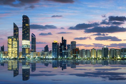 View of Abu Dhabi Skyline at sunset, United Arab Emirates 
