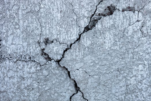 Cracked concrete surface with rich and various texture.