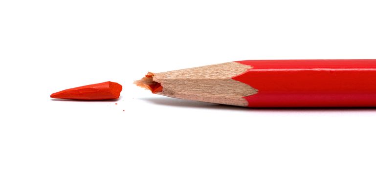 broken red pencil on a white background