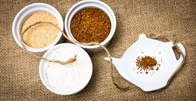 Various type of ingredients poured in several porcelain cups