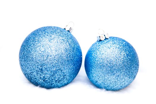 Christmas balls seen up close on a white background
