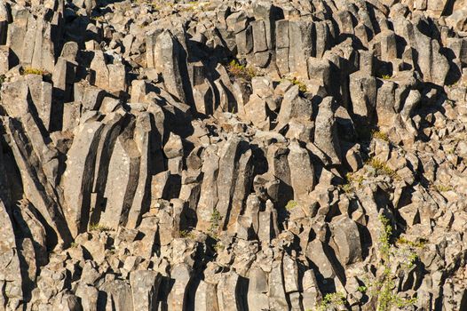 Natural background of hexagonal basalt columns in Icelandic national park Jokulsargljufur