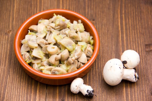 Grilled Mushrooms on bowl on wooden table