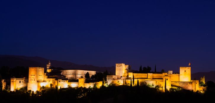 Spain, Granada. The famous Alhambra Royal Palace by night from the best viewpoint