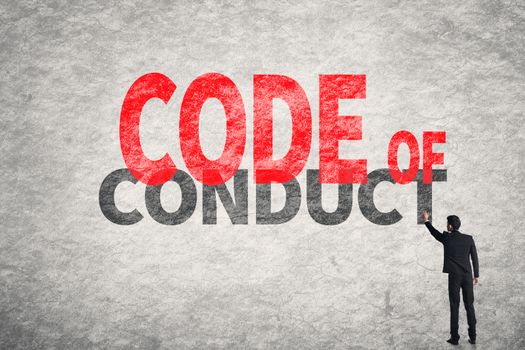 Asian business man write words on wall, Code Of Conduct