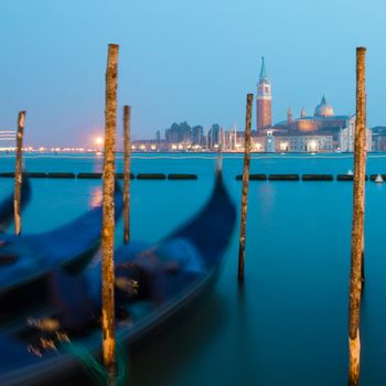 Venice in the evening light with gondolas on Grand Canal against San Giorgio Maggiore church. Italy, Europe. World heritage site.