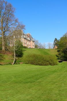 View on beautiful landscape with old mansion at Saint Saens, France