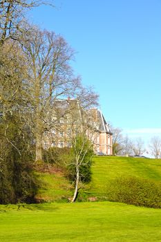 View on beautiful landscape with old mansion at Saint Saens, France
