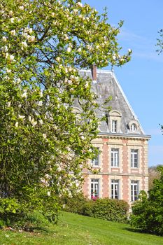 View on beautiful landscape with old mansion at Saint Saens, France