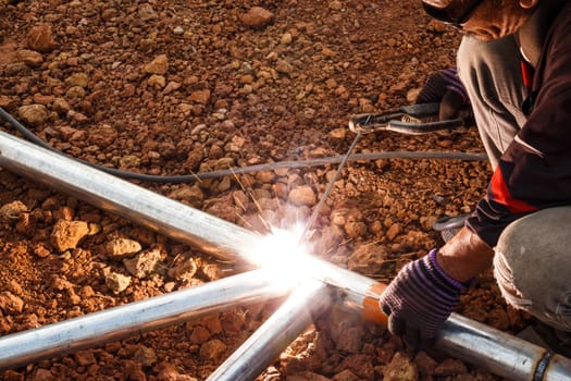 welder with turban is welding in Thailand.