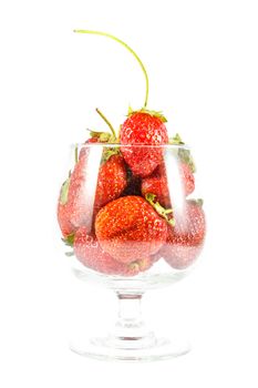 Strawberries in wine glass on white background (isolated)