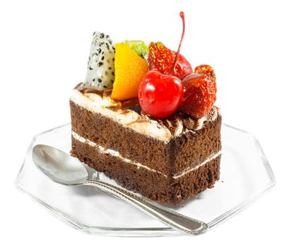 fruitcake and spoon on white background (isolated)