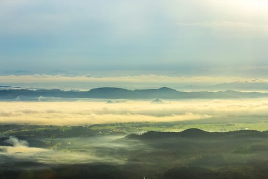 Sunrise over mountain with mist