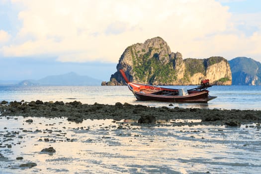 native boat on beach and island in evening at Trang ,Thailand