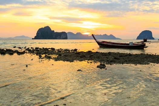 native boat on beach and sunrise in morning at Trang ,Thailand