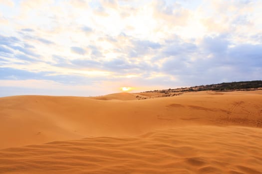 Red sand dune (Mui Ne sand dune) and sunset at South Vietnam