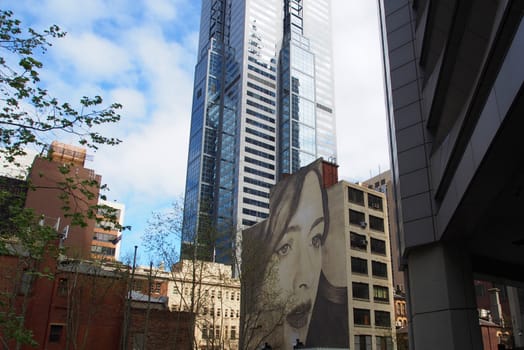 A Large mural of a woman painted on the side of a building, Melbourne