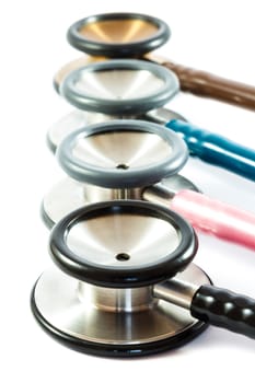 colorful stethoscopes line on white background (isolated)