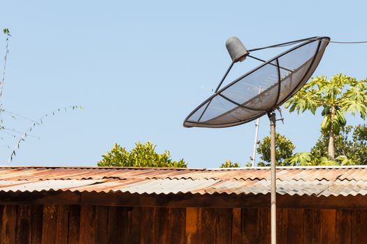 Old satellite dish and rural scene in Thailand