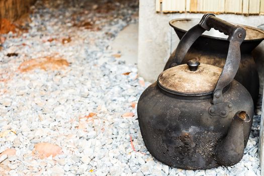 old sooty kettle in house in rural area ,Thailand