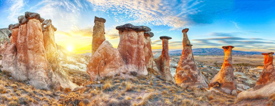 Rocks looking like mushrooms dramatically lit by a sunset in Cappadocia, Turkey