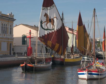 Old fishing ships at the pier in Cesenatico, Italy