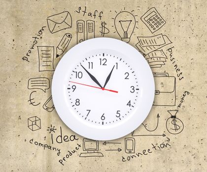 Business concept drawing around wall clock, on smooth stone surface, top view