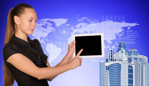 Business woman holds tablet PC, pointing at blank screen. High-rise buildings beside.On blue background with hi-tech graphs and world map. Business concept 