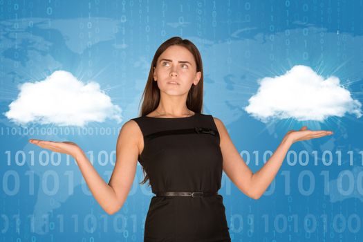 Businesswoman holding two white clouds as if chosing. On blue background with faint world map and binary code rows
