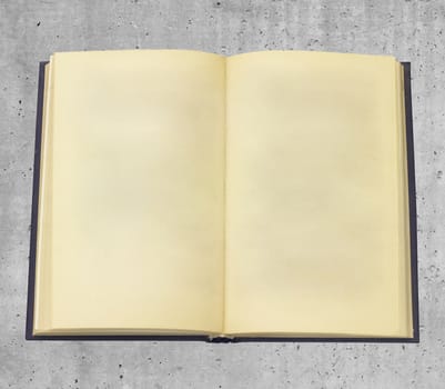 Empty book on smooth stone surface, top view