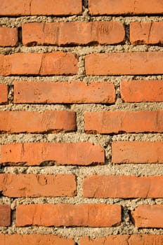 Brick and concrete wall texture background, vertical shot.