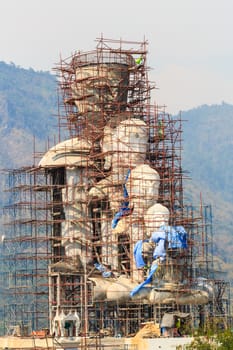 large statue of buddha is under construction and foggy sky at Wat Phra Dhat Phasornkaew ,Phetchabun (Thailand)