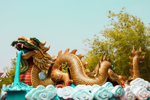 The statue of dragon blow water ,Thailand