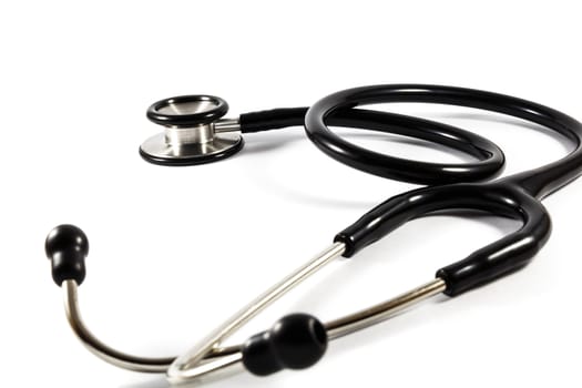 a doctor's black stethoscope on isolated background