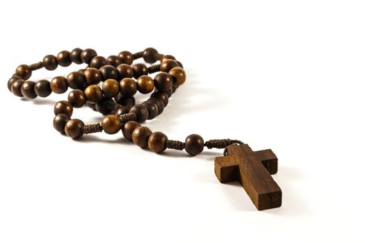 Wood rosary and cross with isolated background