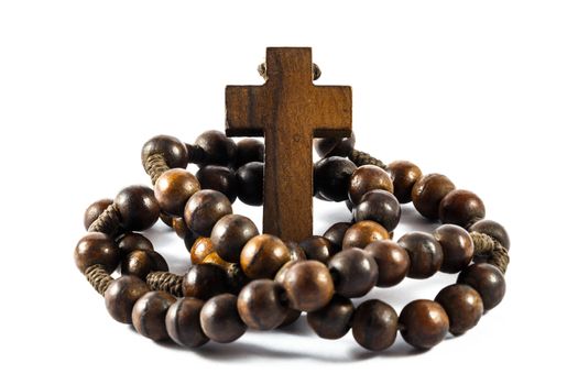 Wood rosary and cross with isolated background