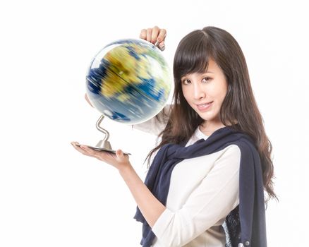 Chinese female with spinning globe of planet earth in her hands