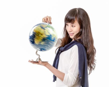 Chinese female with spinning globe of planet earth in her hands