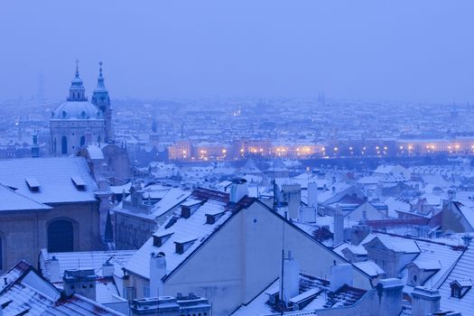 Prague - St. Nicolas church and rooftops of Mala Strana in winter