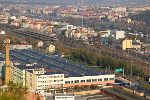 Photo shows a general city view with houses, trees and river.