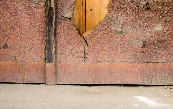 Old chappy surface of painted wooden doors.