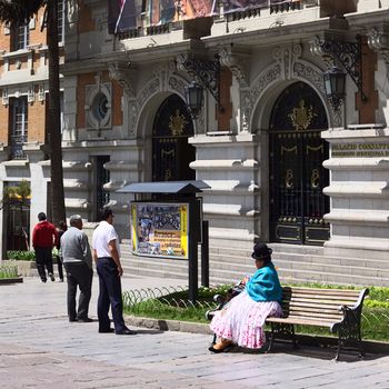 LA PAZ, BOLIVIA - OCTOBER 11, 2014: Unidentified people in front of the entrance of the Palacio Consistorial Gobierno Municipal de La Paz (city hall) on Mercado street in the city center on October 11, 2014 in La Paz, Bolivia