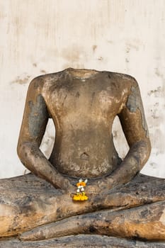 image of headless buddha due to damaged