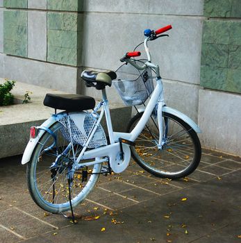 Bicycle fixed gear stop beside concrete wall  commuting in city urban environment, ecological transportation concept.                               