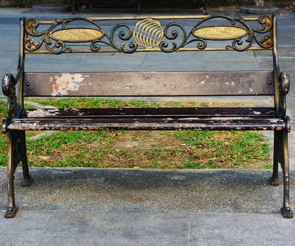 Chair in the park is made of metal,
Gold color painted.                              