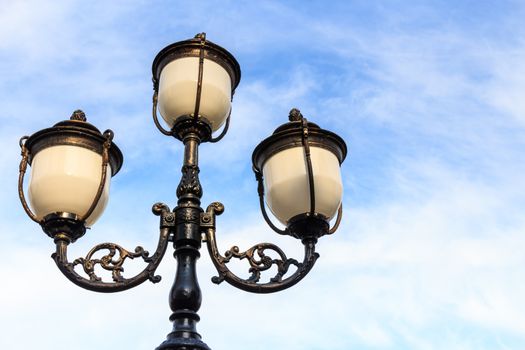 the street lamp and blue cloudy sky with blank area at right side