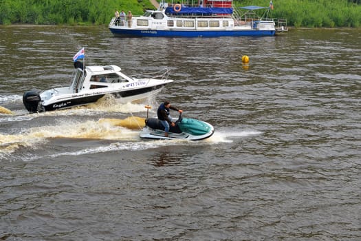 The man on a hydrocycle floats down the river